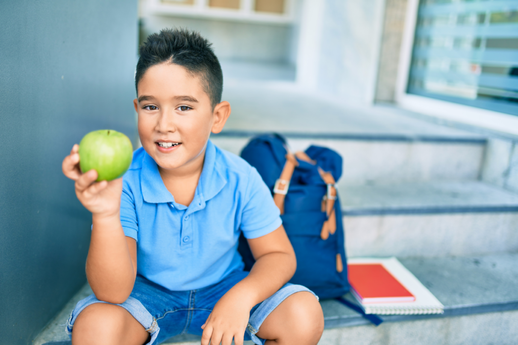Child holding apple